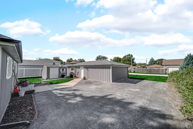 a view of a house with a yard and plants