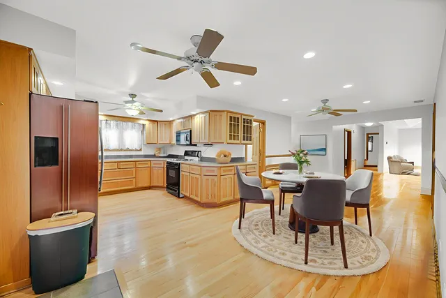 a living room with stainless steel appliances kitchen island granite countertop furniture and a kitchen view