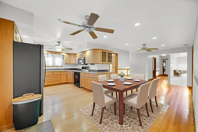 a view of a dining room with furniture and wooden floor