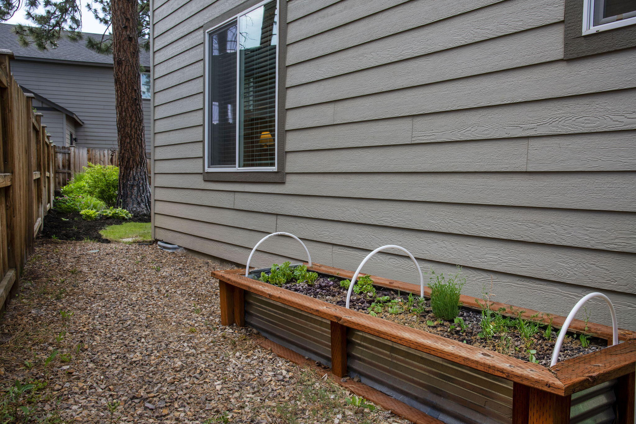 715 Brooks Camp Road Sisters, OR 97759 - Photo 24 of 25 a wooden bench sitting in backside of a house