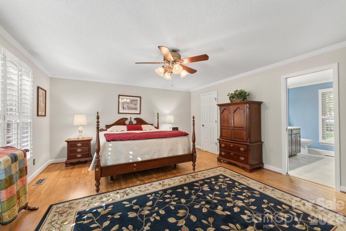 207 Lost Corner Road Morganton, NC 28655 - Photo 31 of 46 a bedroom with a bed and wooden floor