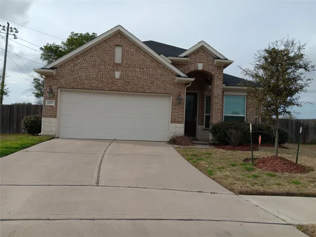a front view of a house with garage