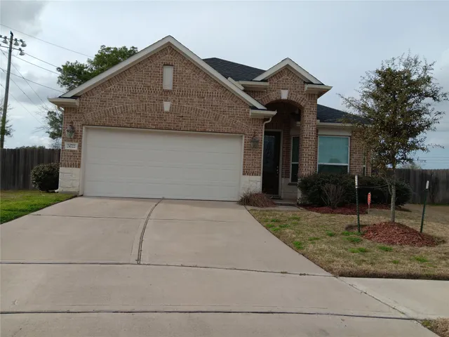 a front view of a house with garage