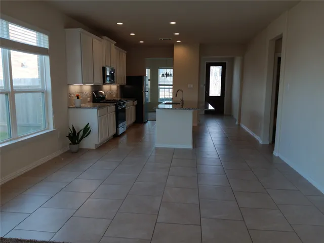 a large space with kitchen view