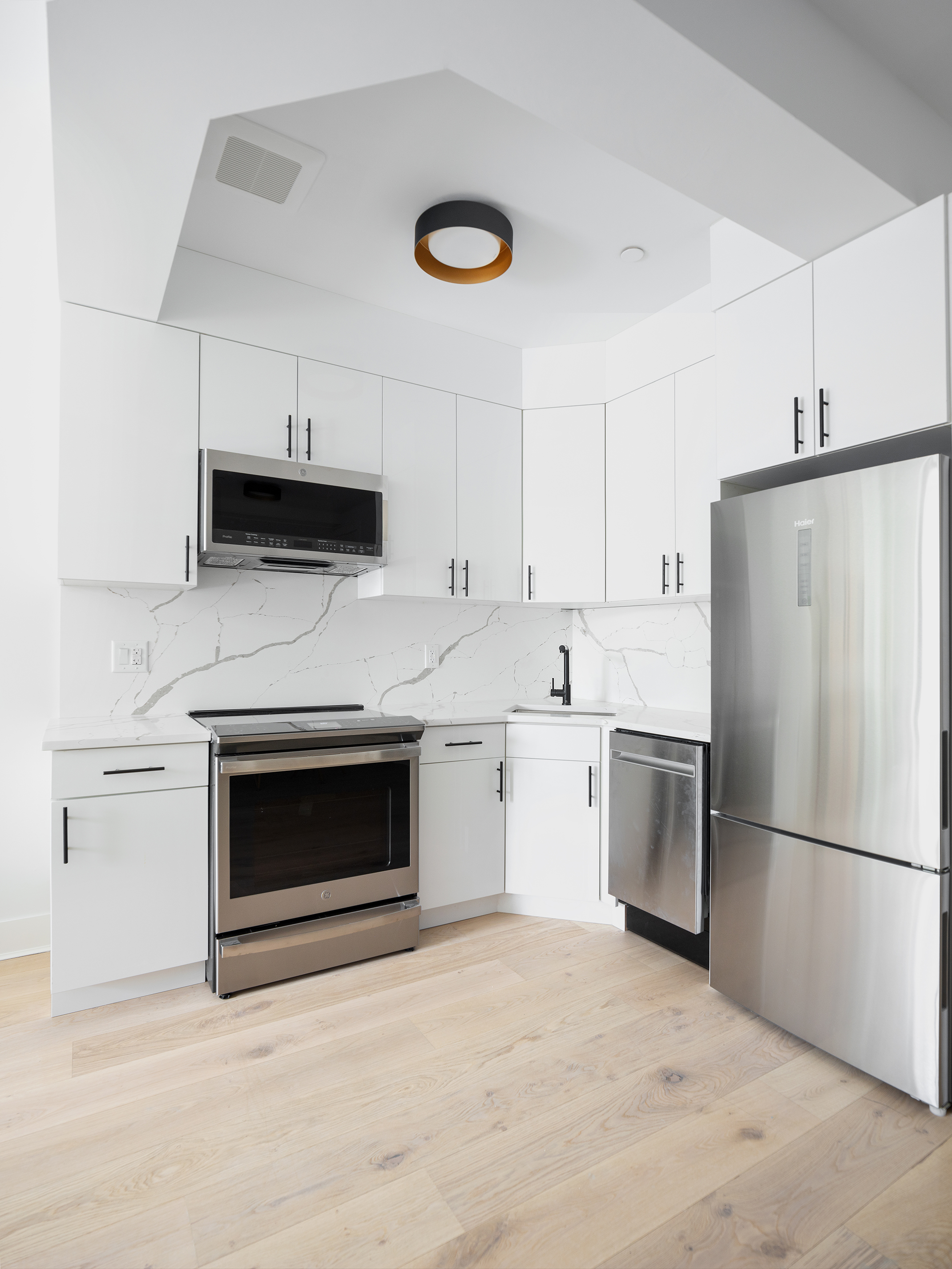 1489 Sterling Place, Unit 1A Brooklyn, NY 11213 - Photo 1 of 1 a kitchen with a stove and a refrigerator