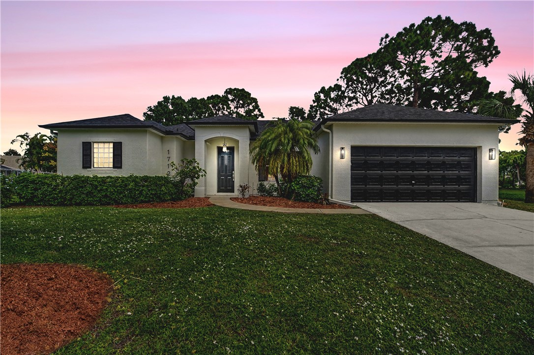 a house view with a garden space