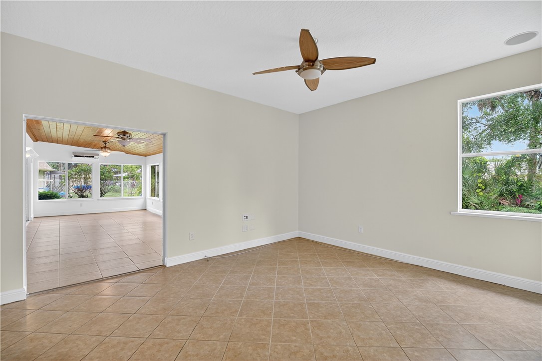 1712 Shakespeare Street Sebastian, FL 32958 - Photo 13 of 36 a view of a livingroom with a ceiling fan and window