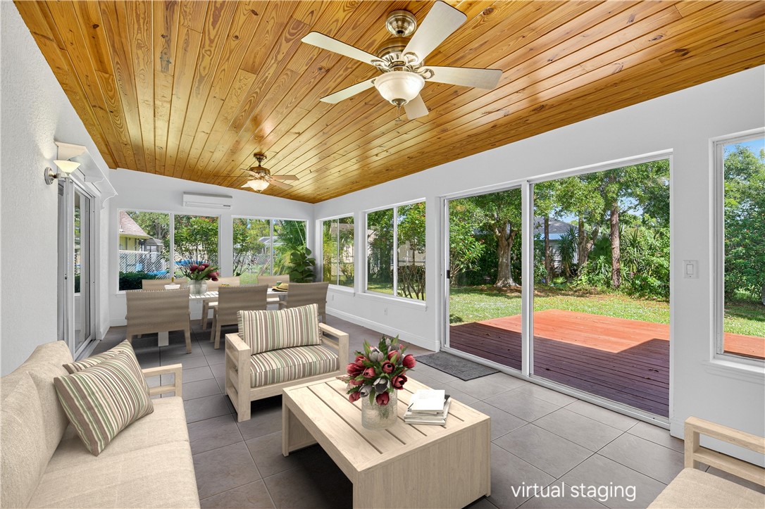 1712 Shakespeare Street Sebastian, FL 32958 - Photo 14 of 36 a living room with furniture and a large window