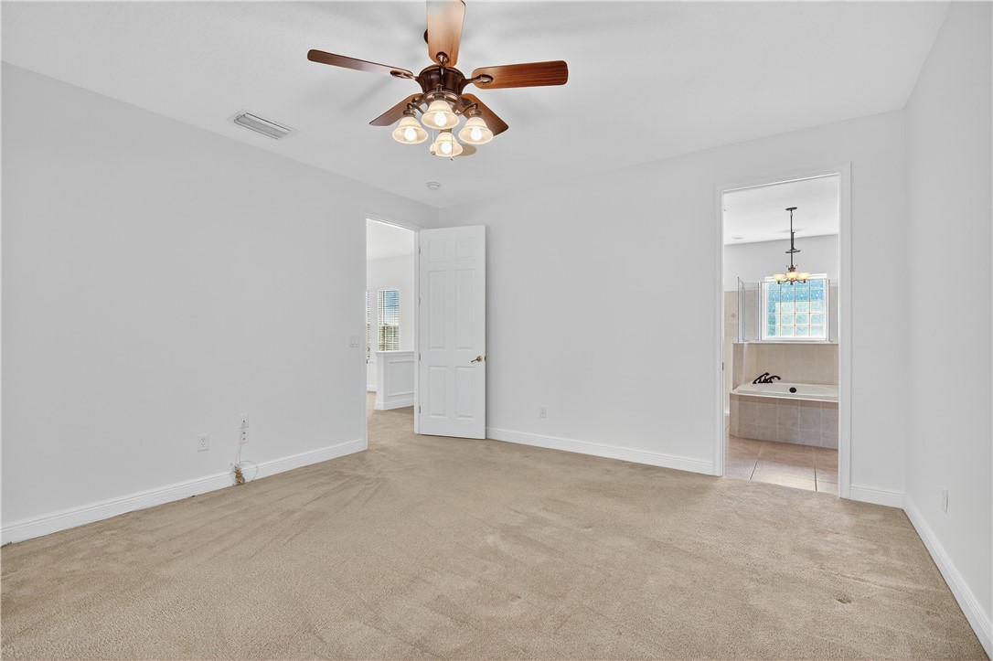 1712 Shakespeare Street Sebastian, FL 32958 - Photo 18 of 36 an empty room with fan and windows