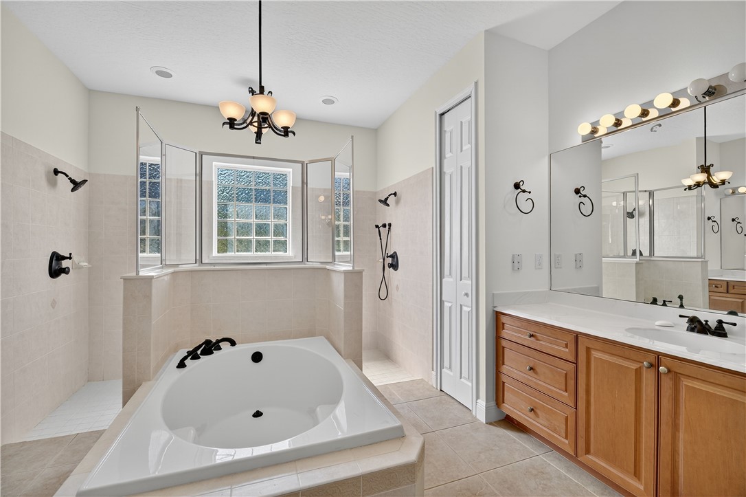 1712 Shakespeare Street Sebastian, FL 32958 - Photo 20 of 36 a bathroom with a tub sink and mirror