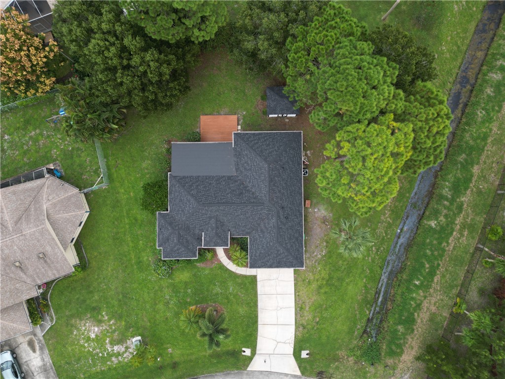 1712 Shakespeare Street Sebastian, FL 32958 - Photo 2 of 36 an aerial view of a house with a yard basket ball court and outdoor seating