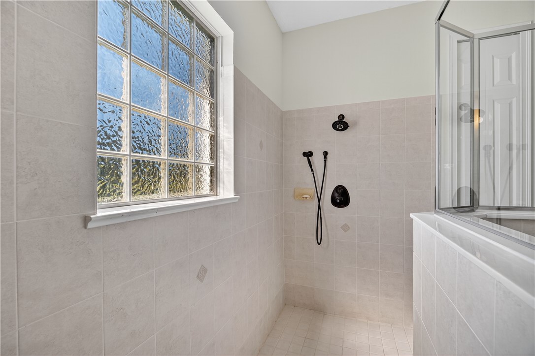 1712 Shakespeare Street Sebastian, FL 32958 - Photo 21 of 36 a bathroom with a sink a toilet and a window