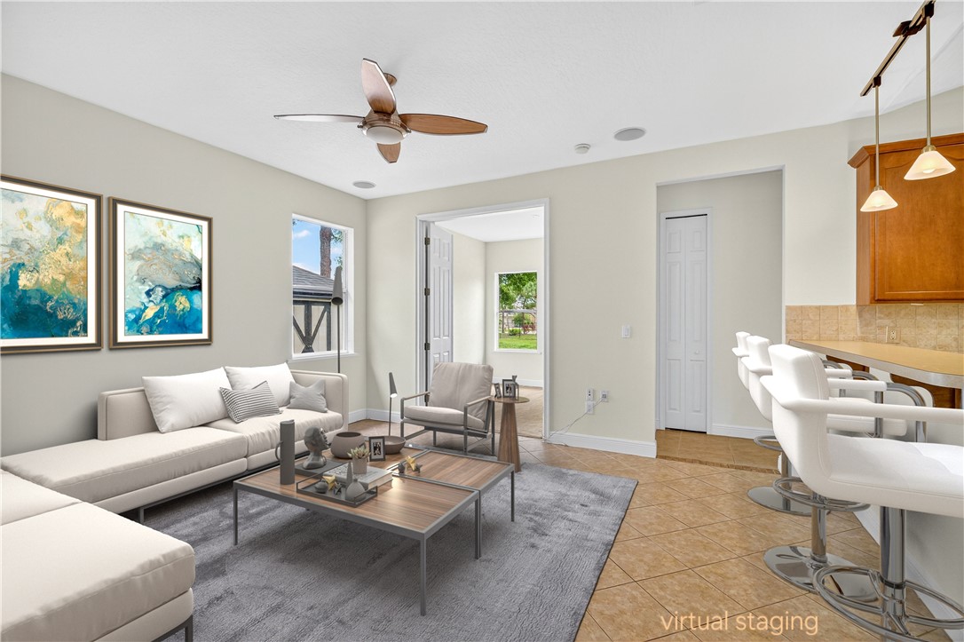 1712 Shakespeare Street Sebastian, FL 32958 - Photo 8 of 36 a living room with furniture and a large window