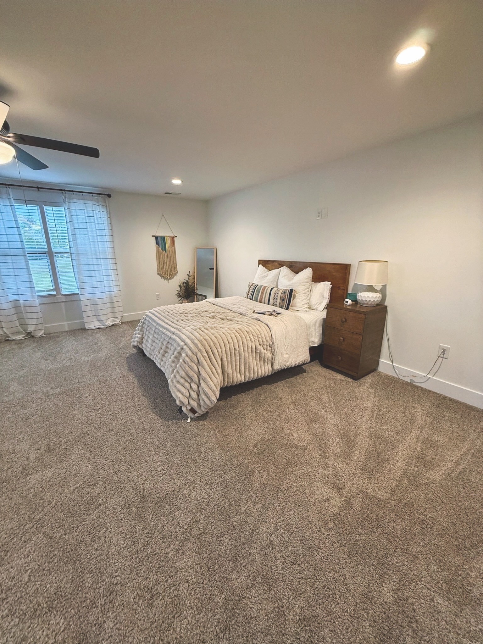 162 Vantrease Road Cottontown, TN 37048 - Photo 18 of 28 a spacious bedroom with a bed and window