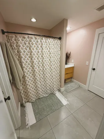a bathroom with a shower and a toilet