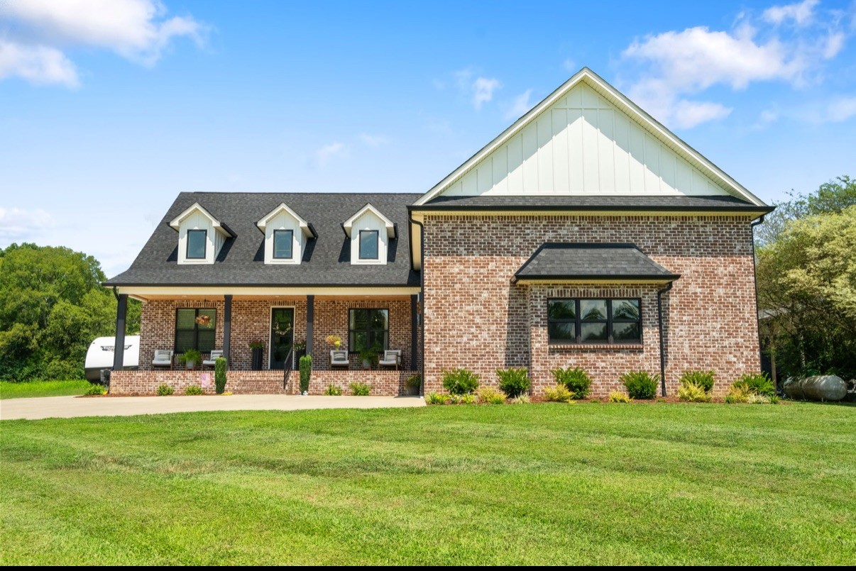 162 Vantrease Road Cottontown, TN 37048 - Photo 2 of 28 a front view of a house with a yard