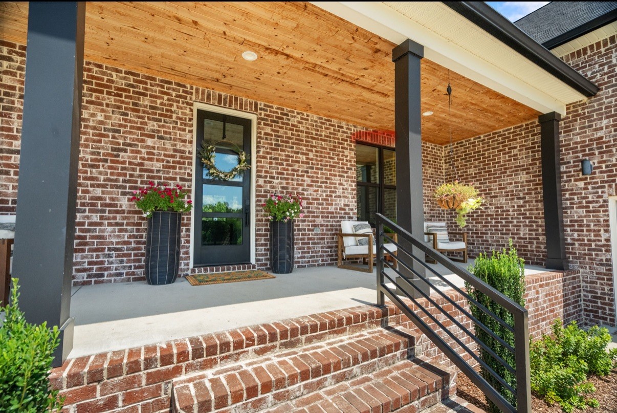 162 Vantrease Road Cottontown, TN 37048 - Photo 3 of 28 a view of a balcony with a potted plant