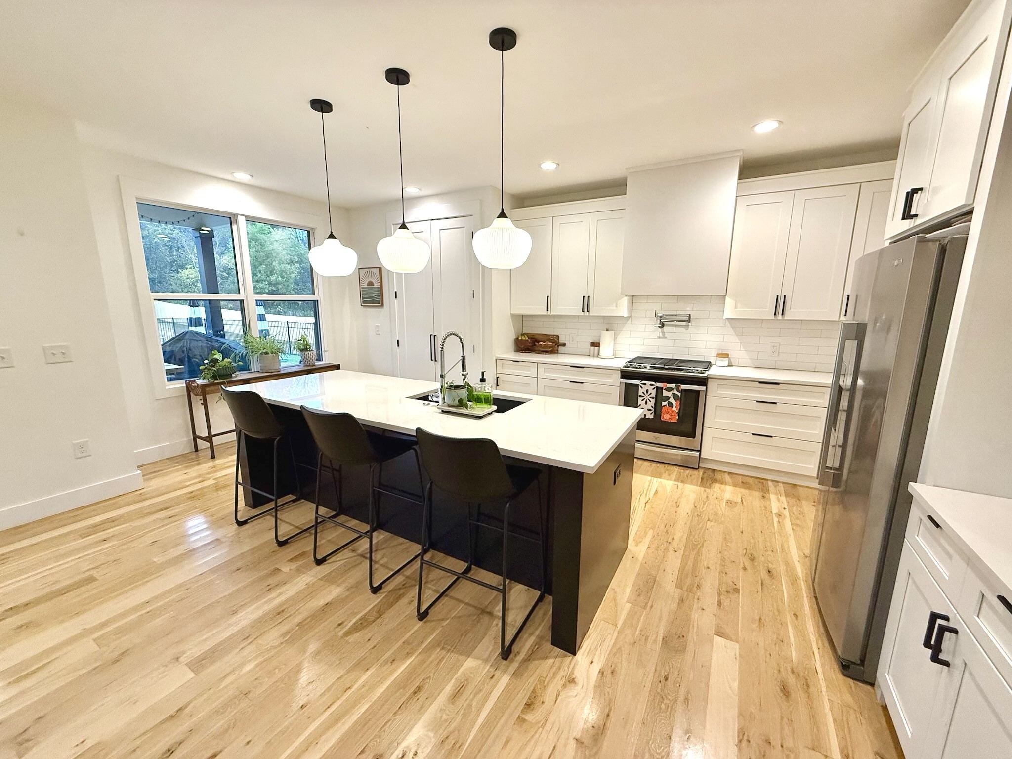 162 Vantrease Road Cottontown, TN 37048 - Photo 6 of 28 a open kitchen with a sink dining table and chairs