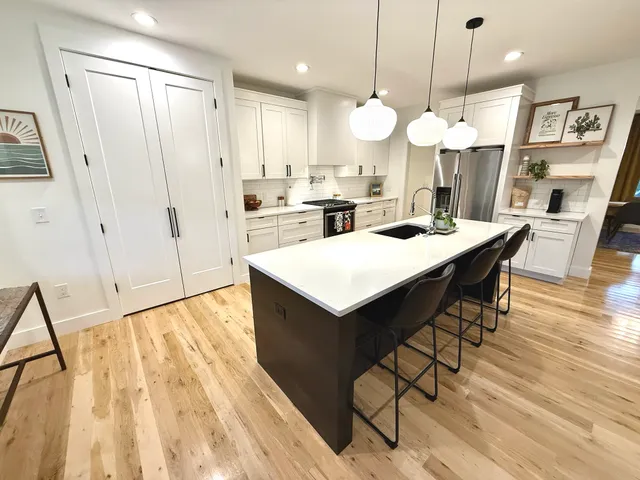 a kitchen with a table and chairs in it