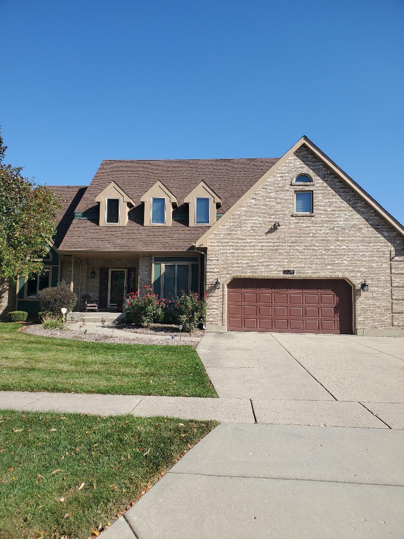1385 Stonegate Road Algonquin, IL 60102 - Photo 1 of 32 a front view of a house with a yard