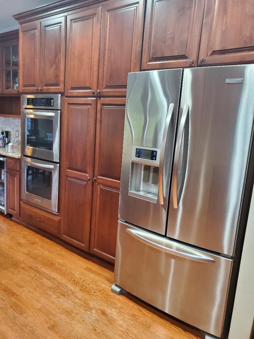 1385 Stonegate Road Algonquin, IL 60102 - Photo 13 of 32 a view of kitchen with stainless steel appliances wooden floor and electronic appliances