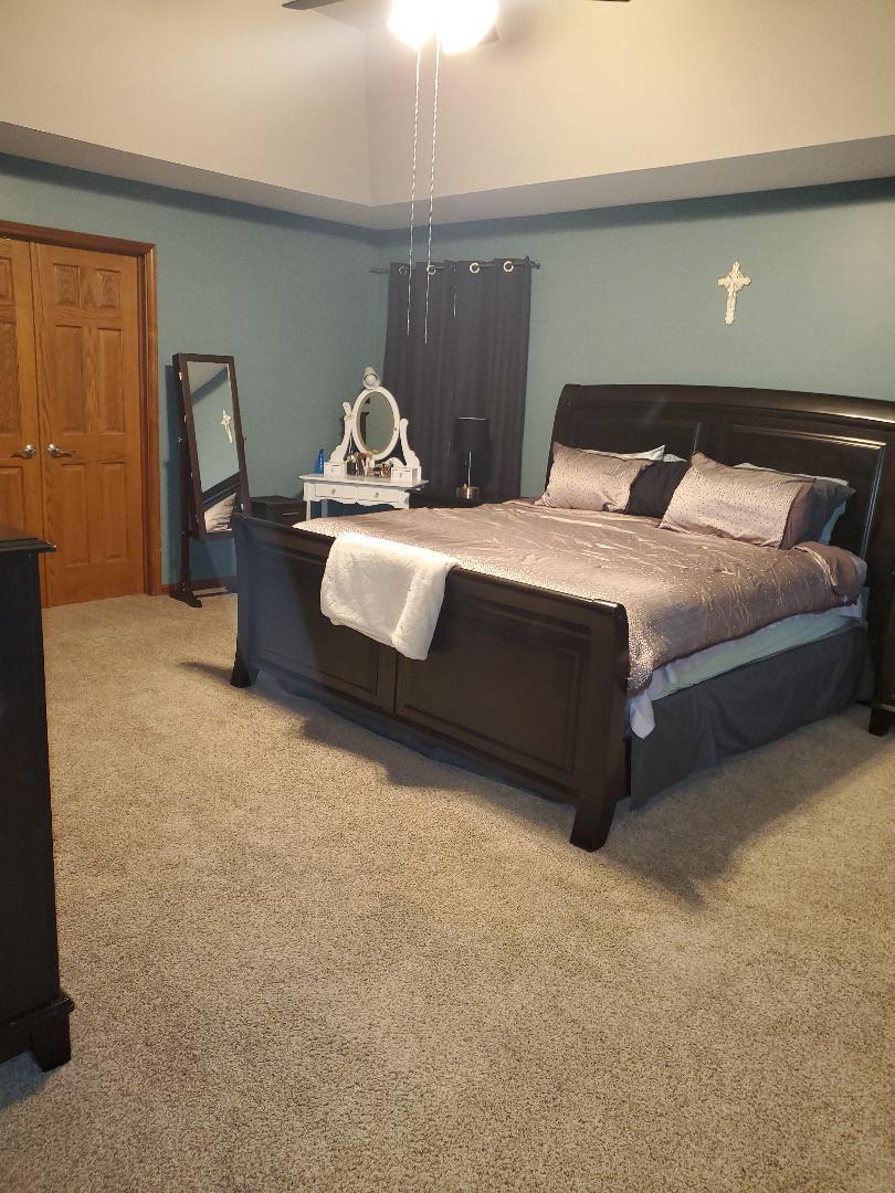 1385 Stonegate Road Algonquin, IL 60102 - Photo 19 of 32 a bedroom with a bed and chair