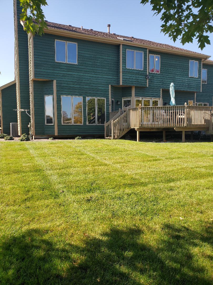 1385 Stonegate Road Algonquin, IL 60102 - Photo 2 of 32 a front view of a house with a yard