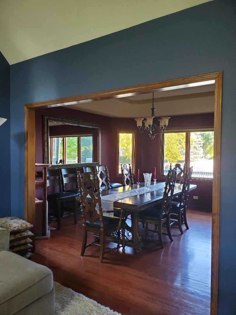 1385 Stonegate Road Algonquin, IL 60102 - Photo 10 of 32 a view of a dining room with furniture window and wooden floor