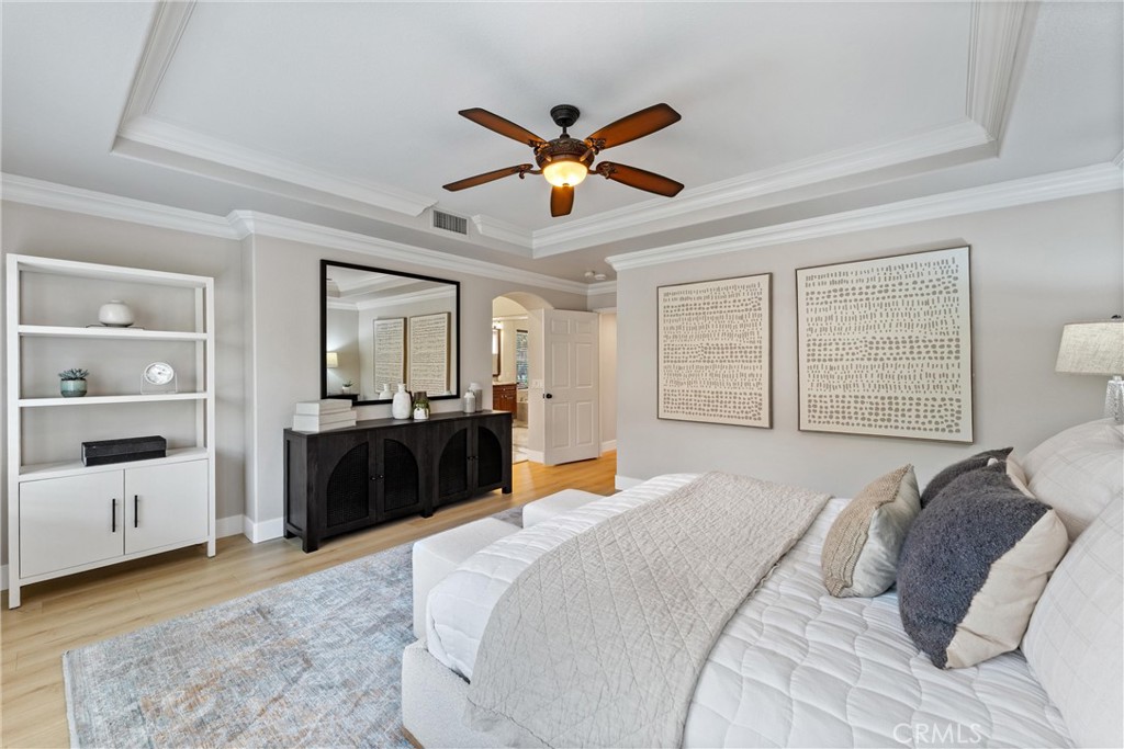 2741 Timmons Tustin, CA 92782 - Photo 20 of 30 a bedroom with a bed and ceiling fan