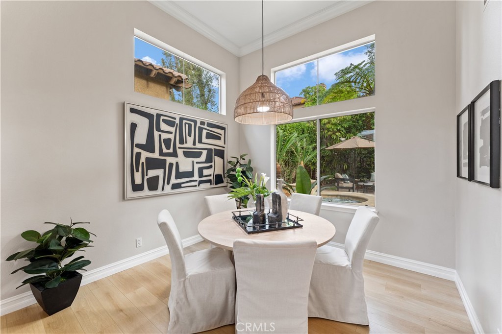 2741 Timmons Tustin, CA 92782 - Photo 5 of 30 a dining room with furniture potted plants and wooden floor