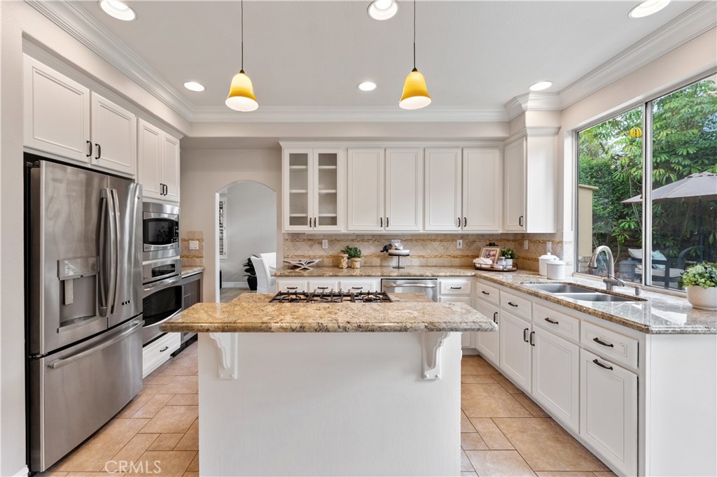 2741 Timmons Tustin, CA 92782 - Photo 7 of 30 a kitchen with a sink stove and refrigerator