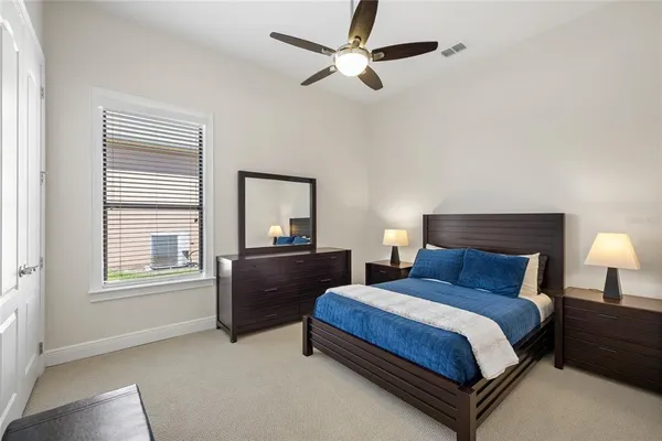 a bedroom with two beds and a window