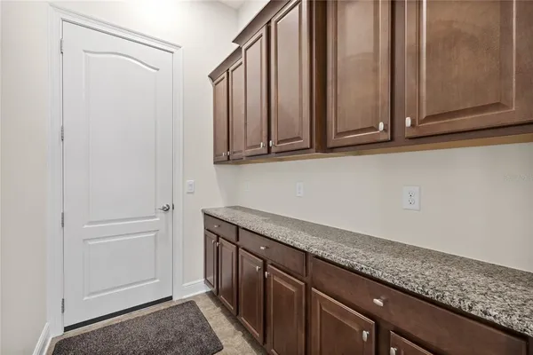 a view of a kitchen with granite countertop cabinets