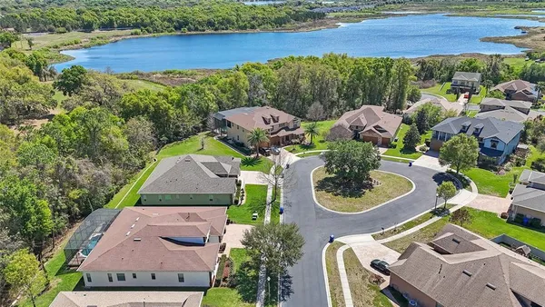 an aerial view of a house with outdoor space