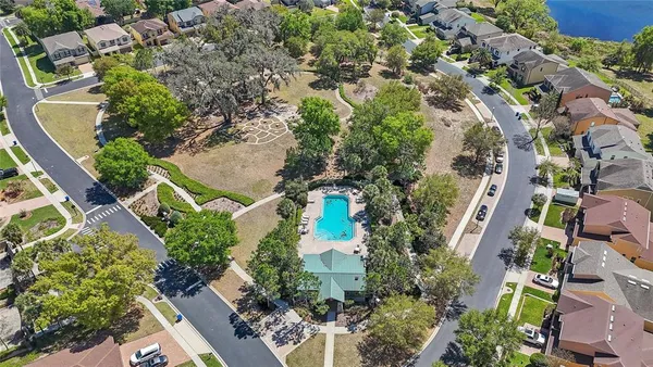 an aerial view of residential houses with outdoor space