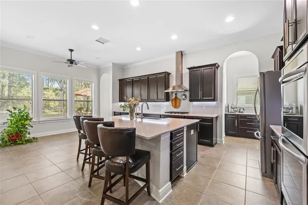 a large kitchen with a table and chairs