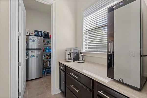 a kitchen with a refrigerator and cabinets