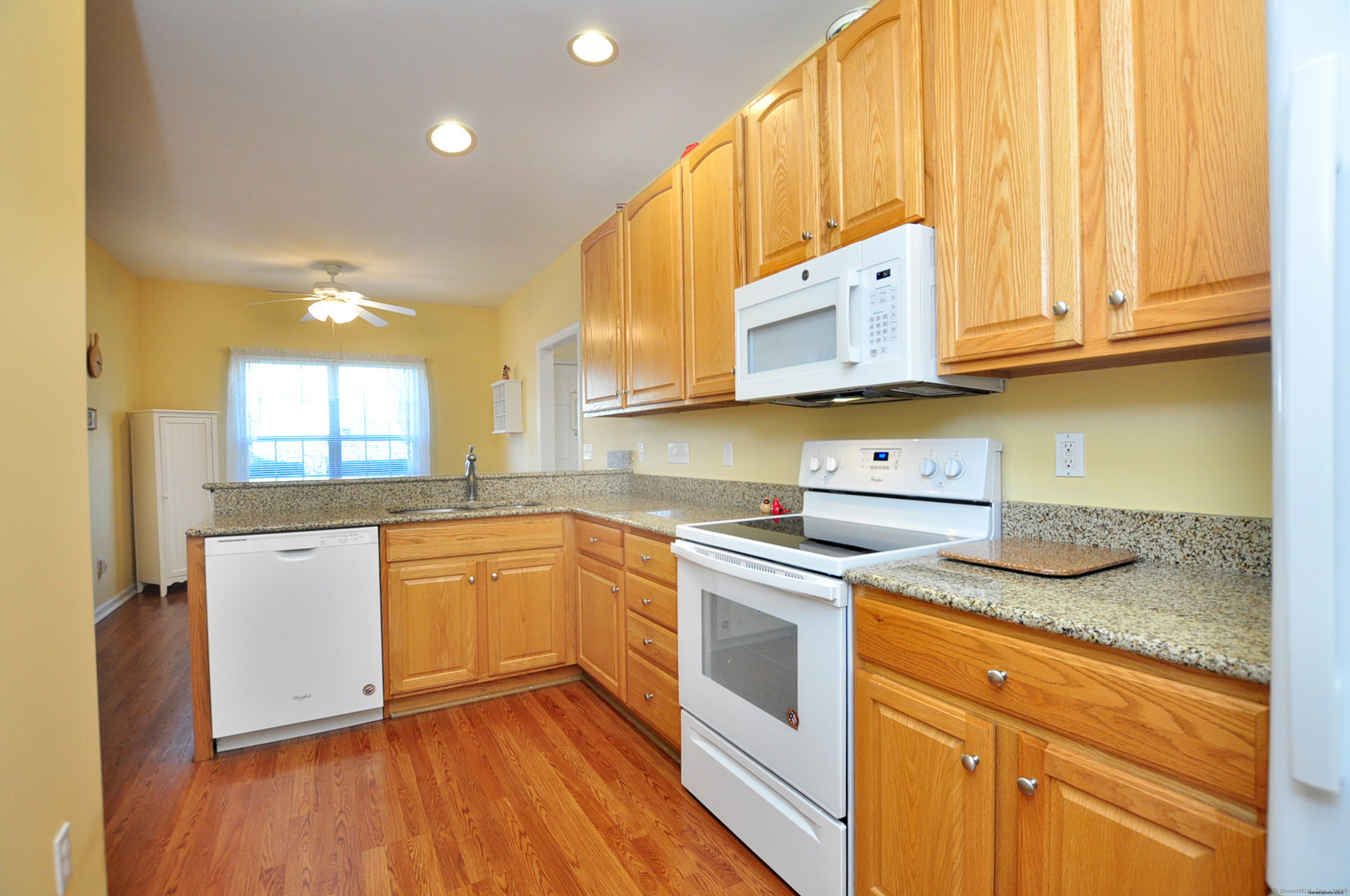 77 Carlson Ridge Road, Unit 77 New Milford, CT 06776 - Photo 17 of 40 a kitchen with stainless steel appliances granite countertop a sink and cabinets