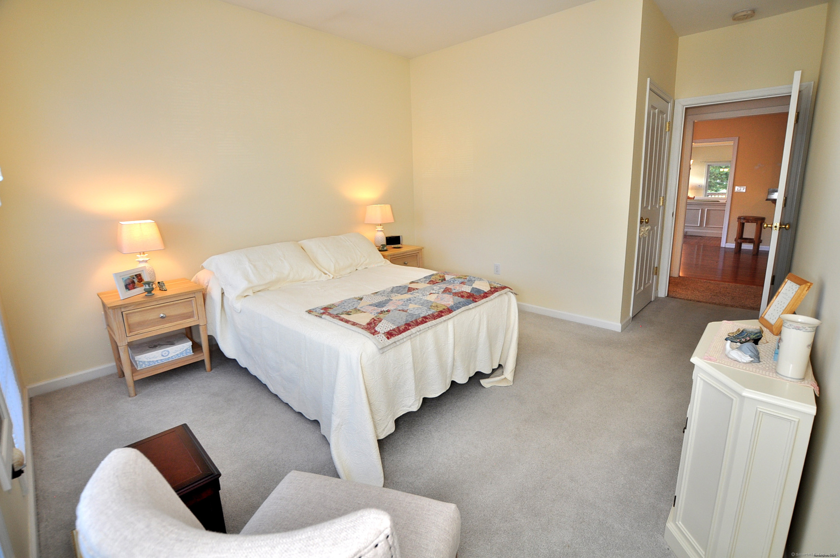 77 Carlson Ridge Road, Unit 77 New Milford, CT 06776 - Photo 24 of 40 a bedroom with a bed and a couch