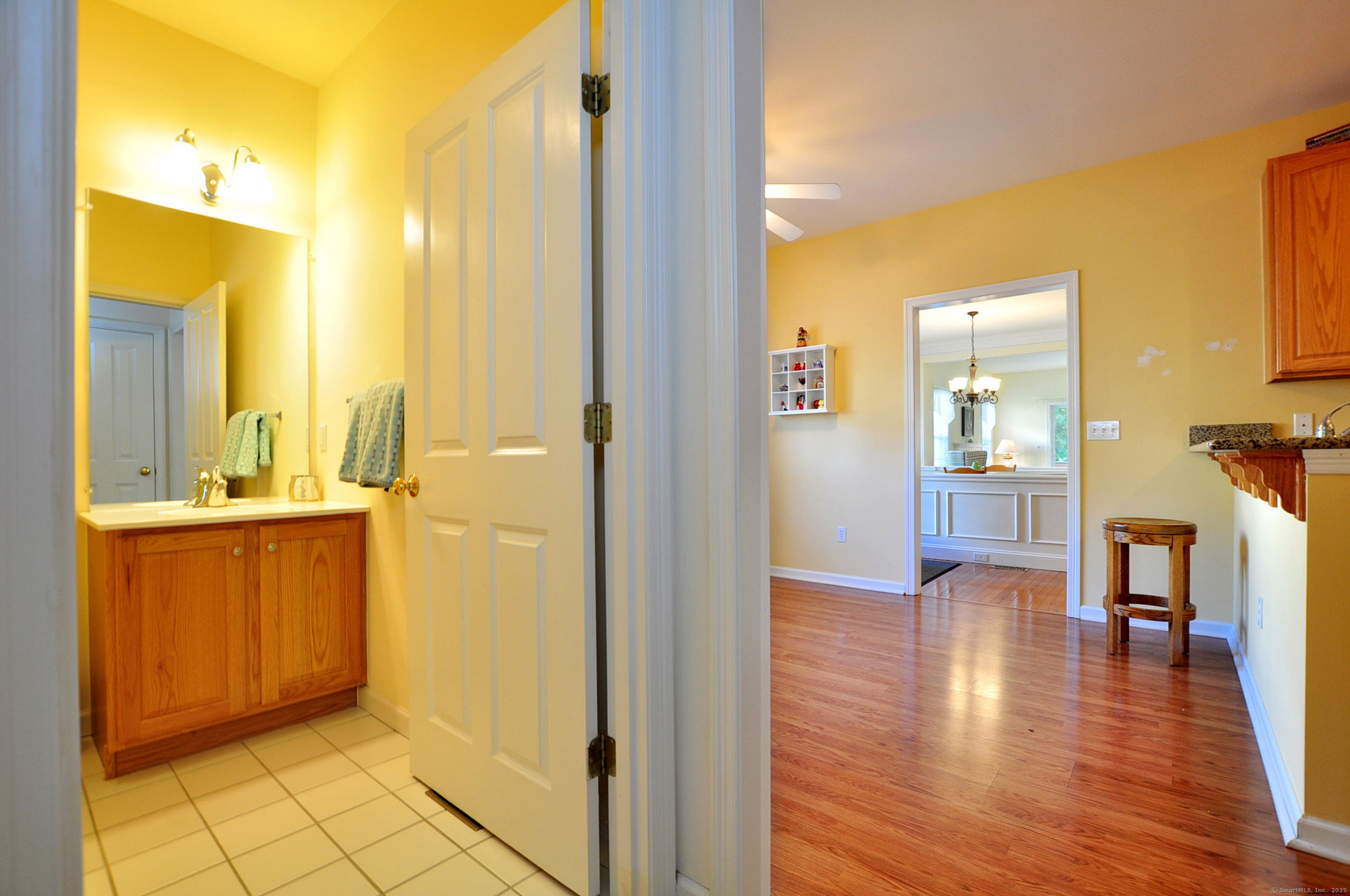 77 Carlson Ridge Road, Unit 77 New Milford, CT 06776 - Photo 25 of 40 a view of a hallway with wooden floor windows and a livingroom