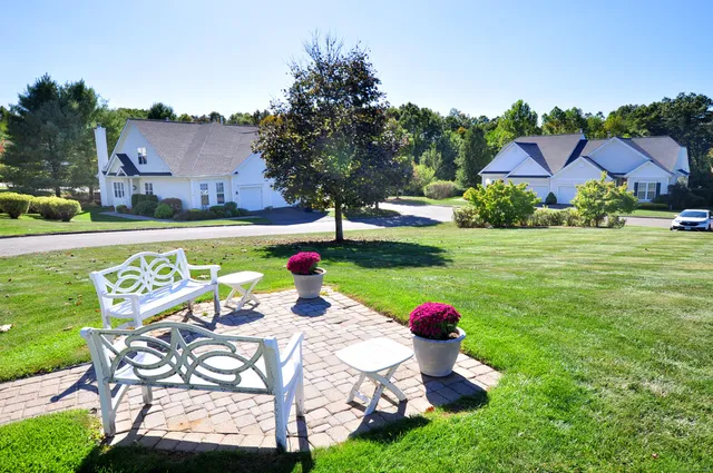 a view of a house with a yard
