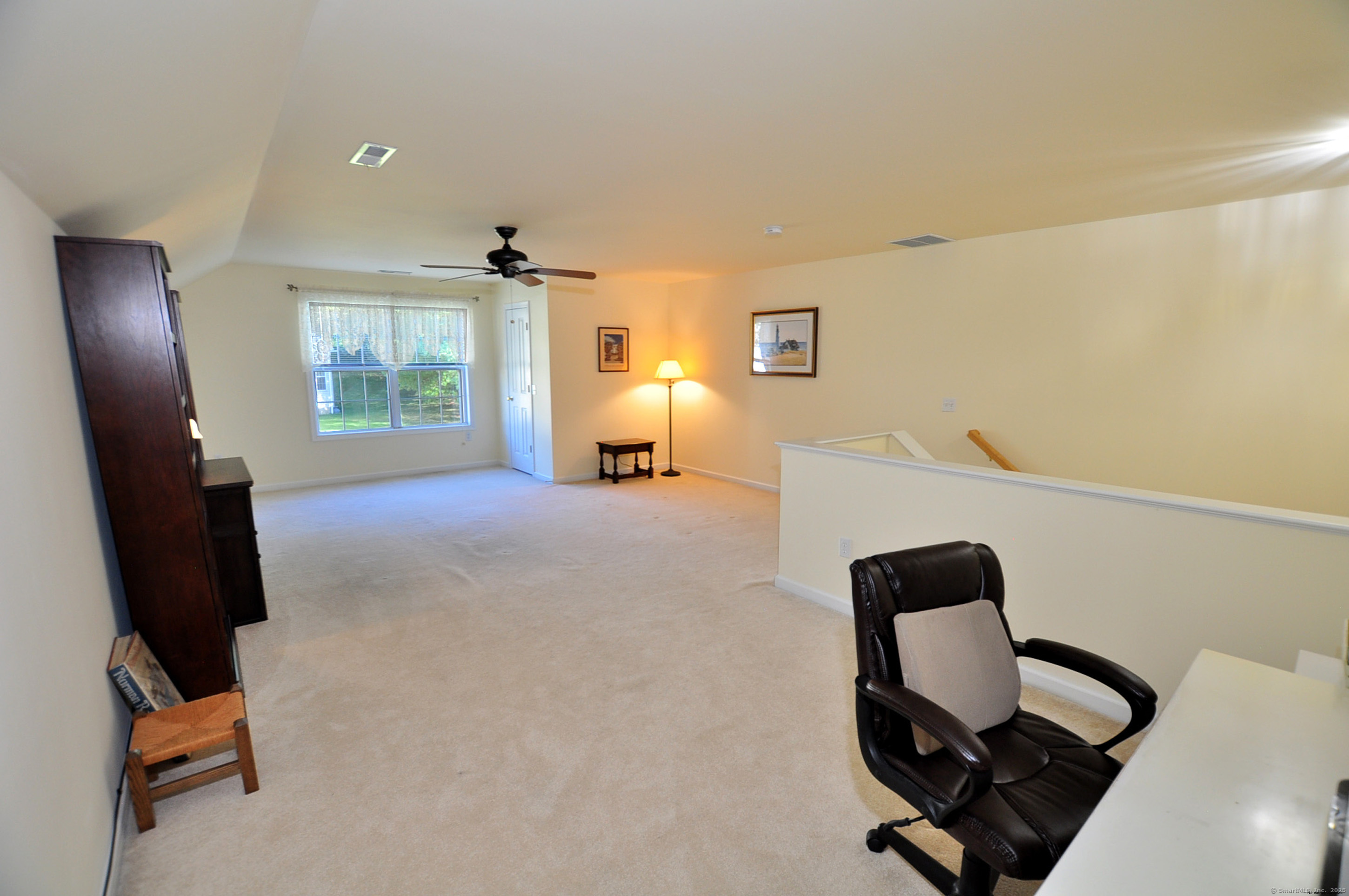 77 Carlson Ridge Road, Unit 77 New Milford, CT 06776 - Photo 32 of 40 a view of a workspace with furniture and a window