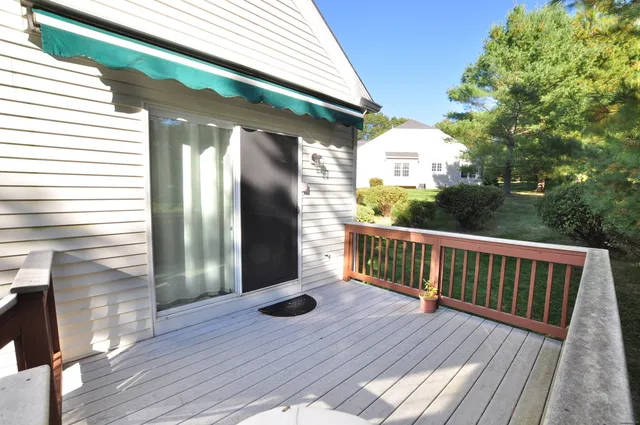 a view of porch with wooden floor