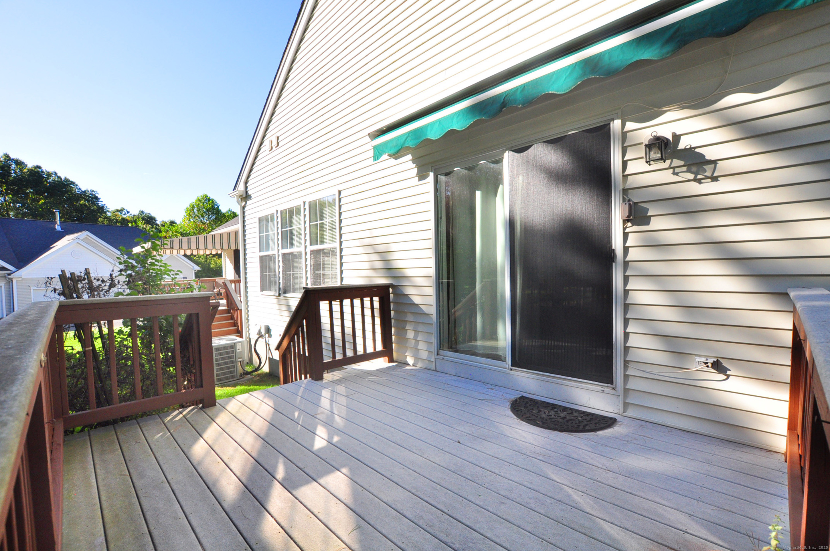 77 Carlson Ridge Road, Unit 77 New Milford, CT 06776 - Photo 37 of 40 a view of porch with wooden floor