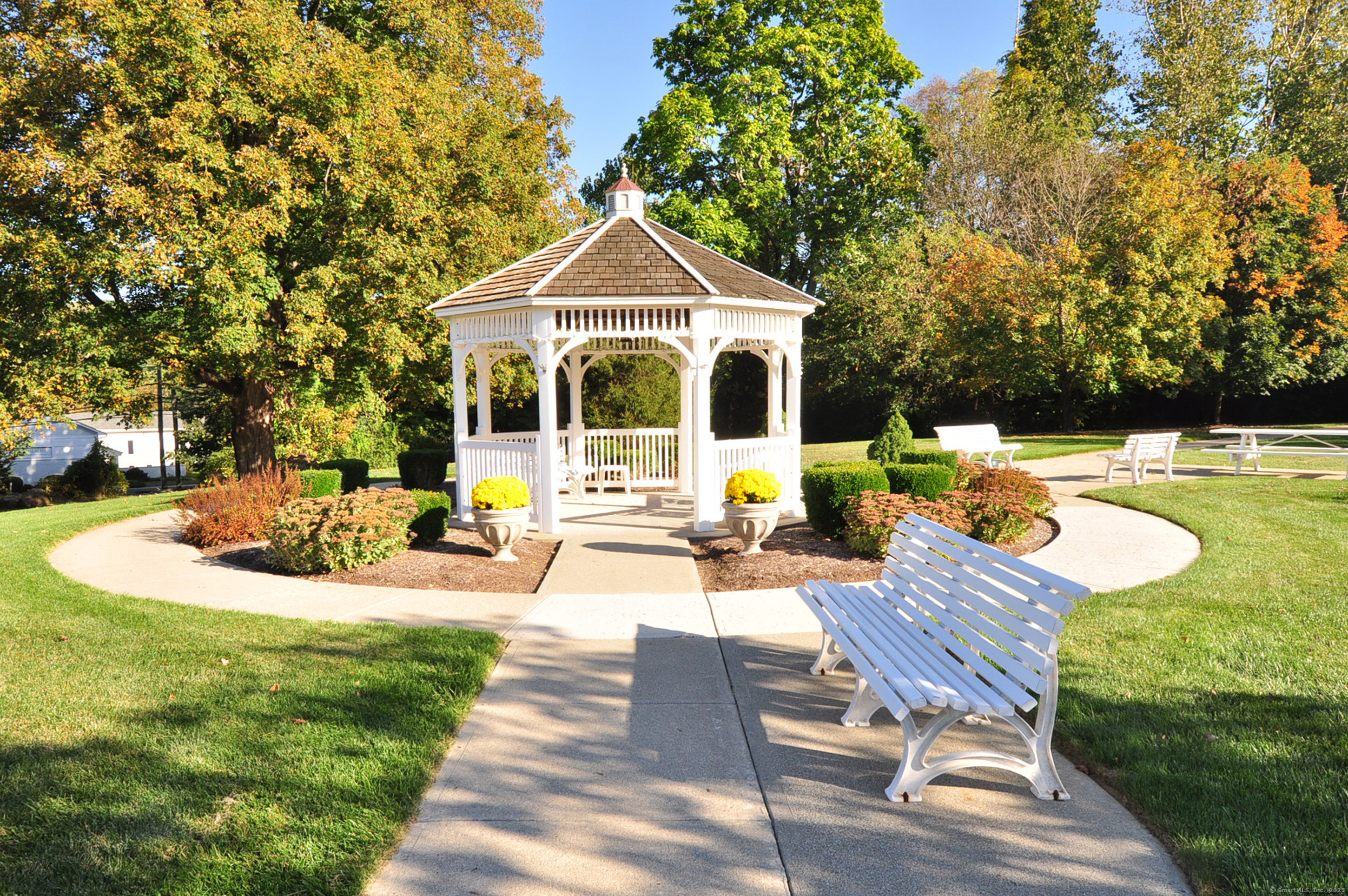 77 Carlson Ridge Road, Unit 77 New Milford, CT 06776 - Photo 39 of 40 a view of a house with backyard and sitting area