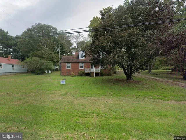 a view of a house with a tiny play ground