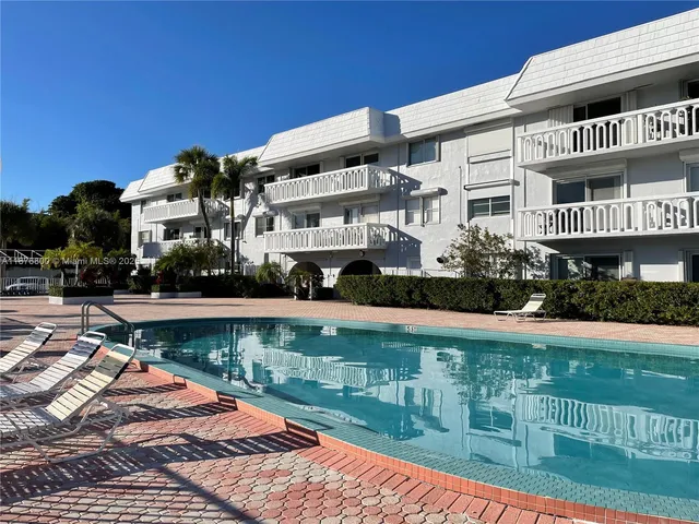 a front view of a building with lake view