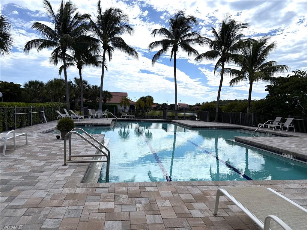 13462 Kent Street Naples, FL 34109 - Photo 28 of 30 a view of swimming pool with a table and chairs