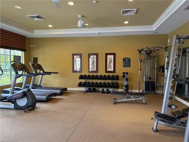 a room with gym equipment and a large window
