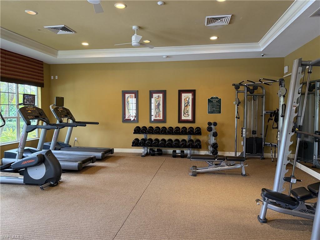 13462 Kent Street Naples, FL 34109 - Photo 29 of 30 a room with gym equipment and a large window